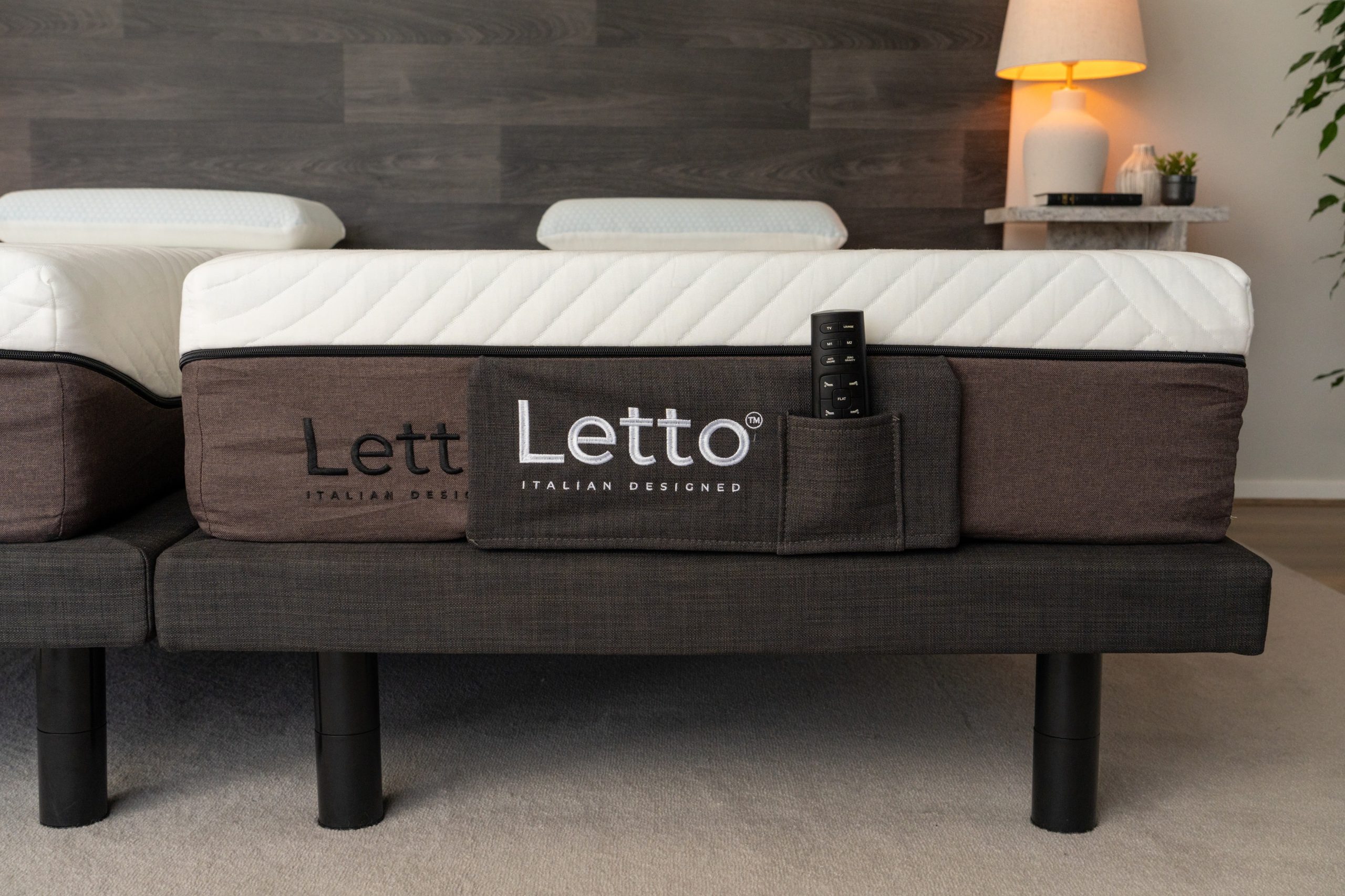 A side view of two Letto adjustable mattresses, showing the remote control in a side pocket, highlighting features to consider when learning how to choose a mattress.